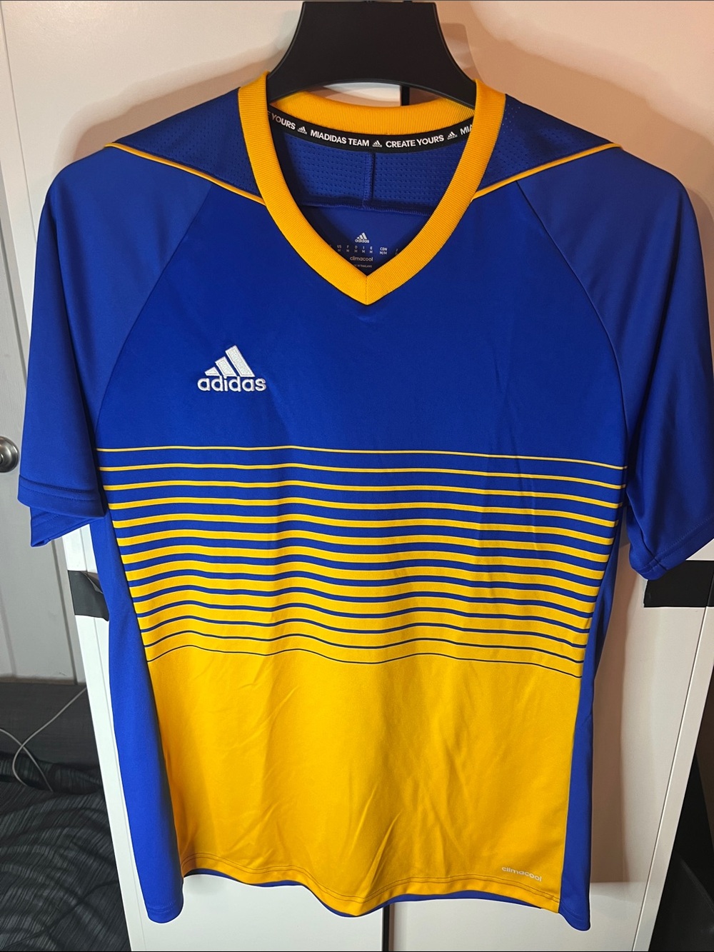 Adidas V-neck jersey.